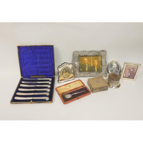 23 - Silver cigarette box, four mounted frames and other items.