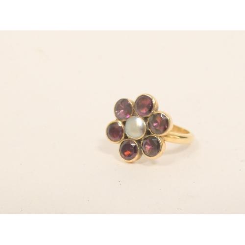 30 - Garnet and pearl cluster ring, and another onyx. Both likely 9ct gold (2)