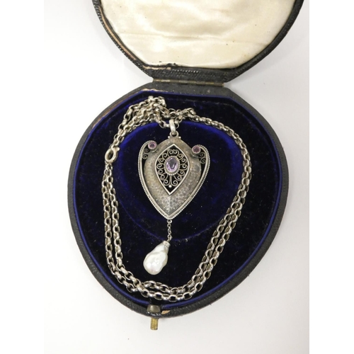 33 - Early 20th century continental silver pendant in the jugendstil style with central amethyst in filig... 