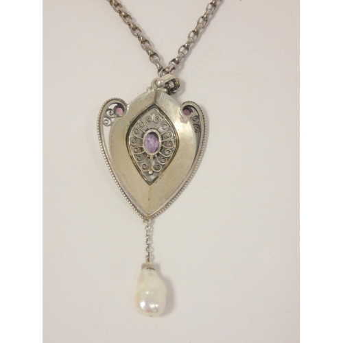 33 - Early 20th century continental silver pendant in the jugendstil style with central amethyst in filig... 