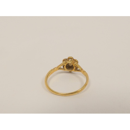 34 - Gold diamond seven stone cluster ring with millgrain set brilliants, 8.5mm across. Size N. 2g