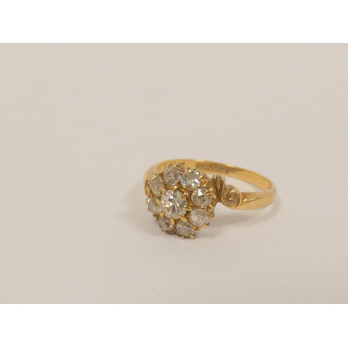 35 - Diamond nine stone cluster ring with old cut brilliants, in 18ct gold c1930. Size M. 3.3g.