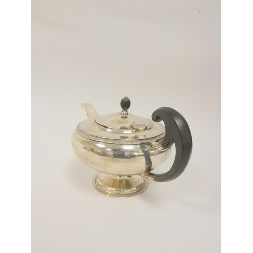 7 - Silver tea pot with ebony surmount by John Round, Sheffield 1929. 628g