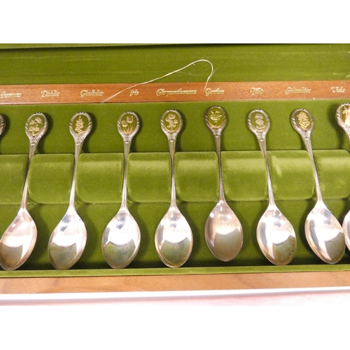 8 - Set of twelve silver R.H.S Flower spoons, in wooden case. 235g 