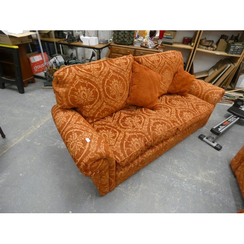 514 - Floral terracotta colour modern three piece suite comprising two seater sofa and a pair of arm chair... 