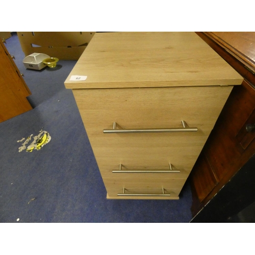 62 - Modern bedside chest of three drawers.