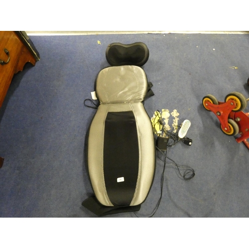64 - Electric massaging pad with remote control.