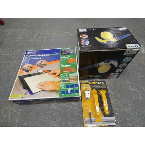 9 - Electric tile cutter and boxed steamer....
