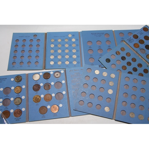 658 - Five Whitman blue coin folders containing an assortment of coins to include NEW ZEALAND, AUSTRALIA, ... 