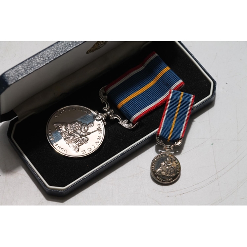 663 - National Service medal and matching miniature medal in Royal British Legion case.