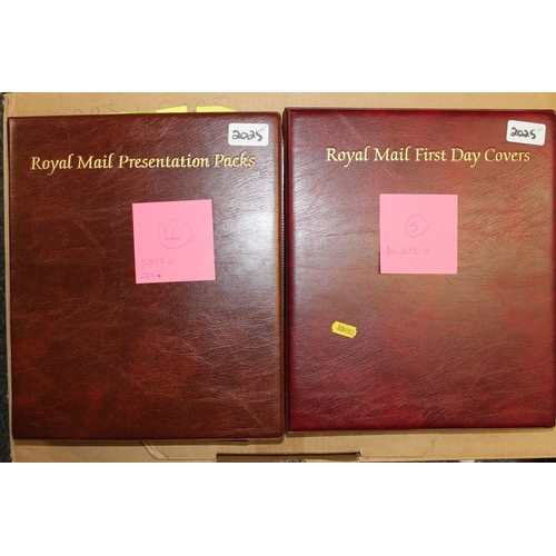 702 - Two Royal Mail red leatherette binder albums containing stamps spanning 1997-2001 to include mostly ... 