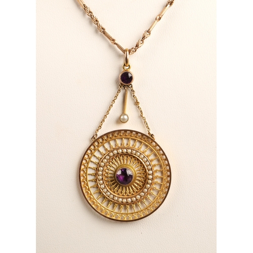 105 - 9K gold Indian style pendant on chain set with two amethysts and seed pearls, gross weight 9.9g