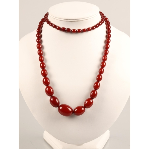 53 - Graduated string of cherry amber / resin bead necklace, approx. 53g