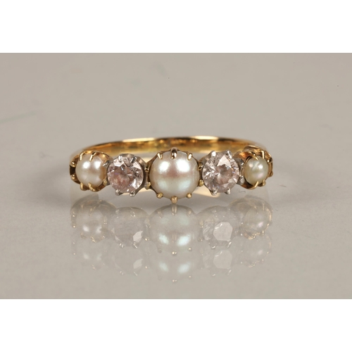 56 - Yellow metal ring illegibly marked, set with pearls and white gems, gross weight 3.3g