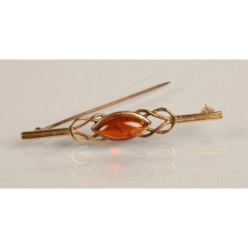 57 - 9K gold bar brooch set with amber / resin cabochon, gross weight 2.6g