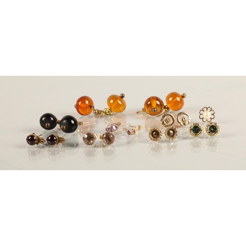 69 - Three pairs of amber /  resin bead earrings, and assorted gold and yellow metal stud earrings, ... 