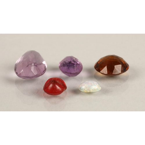 70 - Five loose gems, two purple amethyst coloured, one smoky brown coloured, a red, and an imitation opa... 