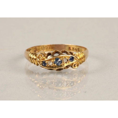 74 - 18ct gold ring set with diamonds and blue gems, ring size R, 2.4g