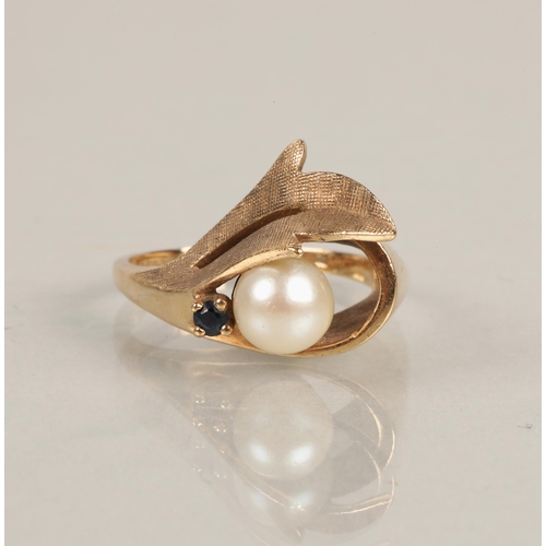 79 - 9ct gold ring set with a blue gem and a pearl, ring size L/M, 5g