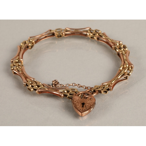 90 - 9ct rose and yellow gold bracelet with heart locket, 8g