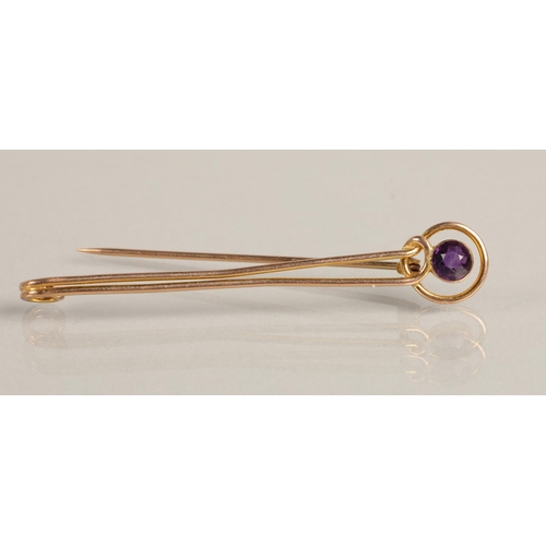 98 - 9K gold pin brooch set with purple gem, 3.4g