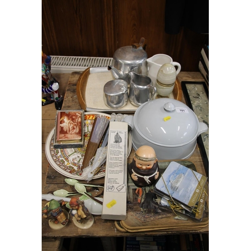 101 - Picquot ware teaset on tray, an onyx egg, fans, a Goebel monk figure, two Hummel figurines, placemat... 