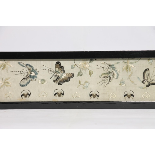 102 - Chinese needlework on silk sleeve panel in frame, 52cm x 10cm.