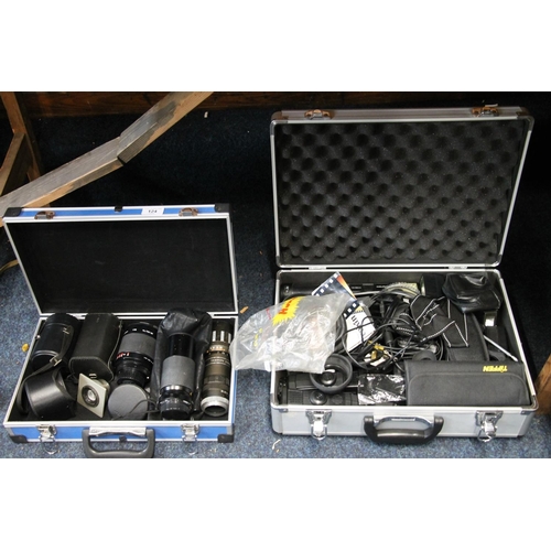 124 - Two cases containing camera lenses and accessories to include a Tamron zoom lens, a Centon mirror le... 