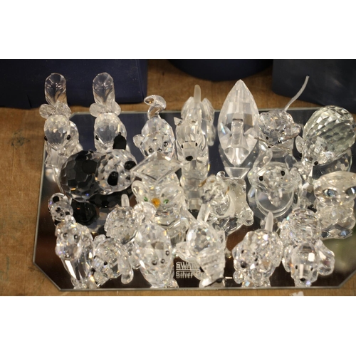 134 - Swarovski Crystal animal models to include a monkey and a panda, both boxed, elephants, ducks, dogs,... 