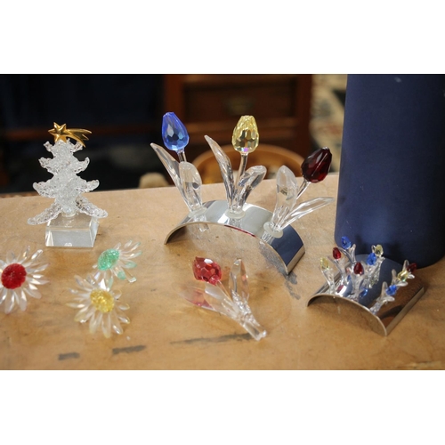 136 - Swarovski Crystal flower models to include bouquets on stand, flowerheads, a Christmas tree, etc.