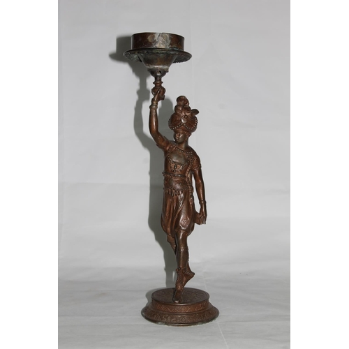 14 - Cast spelter bronzed candle stand with Blackamoor figural support, 43cm high.