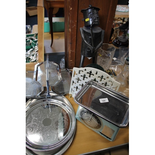 141 - Kitchenalia to include vintage Tower scales, a cast metal bookstand, also a tin man garden ornament ... 