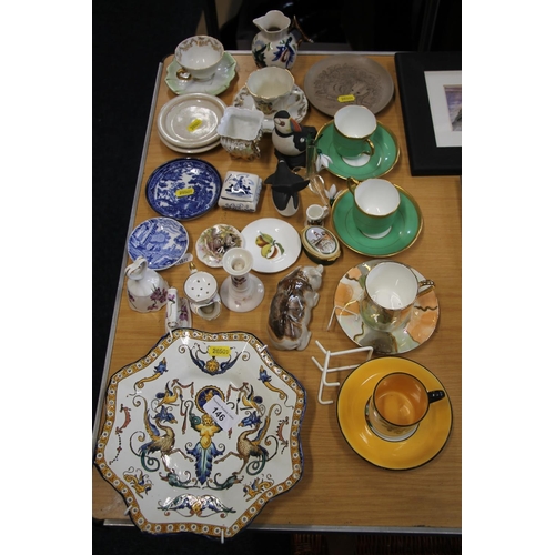 146 - Ceramics to include an Italian Maiolica dish, coffee cans and saucers, a puffin and dolphin model, a... 