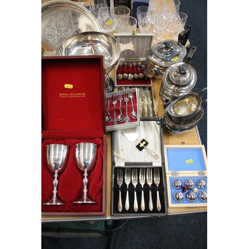 149 - Silver-plated ware to include a pair of boxed Selangor goblets, a pair of pastry knives, a four piec... 