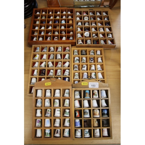 153 - Six wall displays containing thimbles.