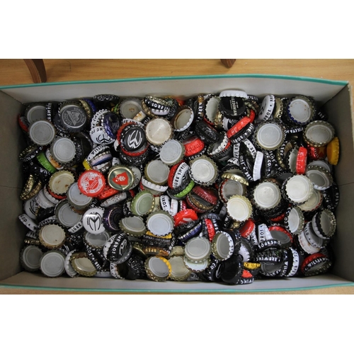 156 - Box containing a large collection of bottle caps.