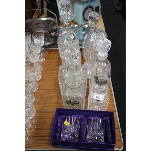 163 - Pair of Edinburgh Crystal whisky tumblers, boxed, and eight cut-glass decanters, some with labels.