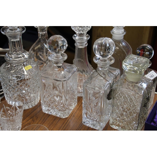 163 - Pair of Edinburgh Crystal whisky tumblers, boxed, and eight cut-glass decanters, some with labels.