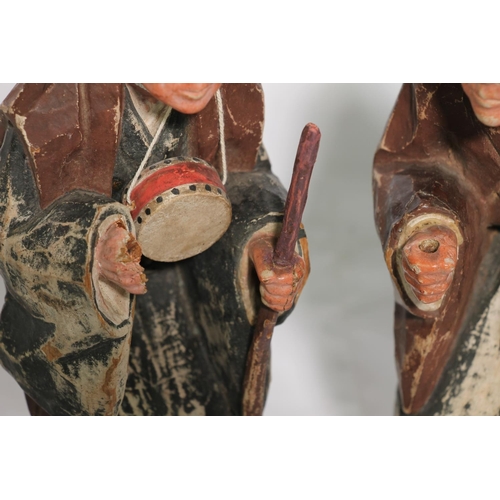 180 - Pair of oriental chip carved painted wooden figures, 25cm.