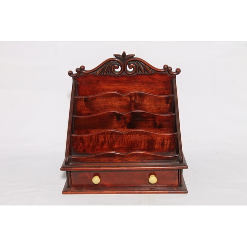 181 - Mahogany stationery rack with base drawer, 33cm high.