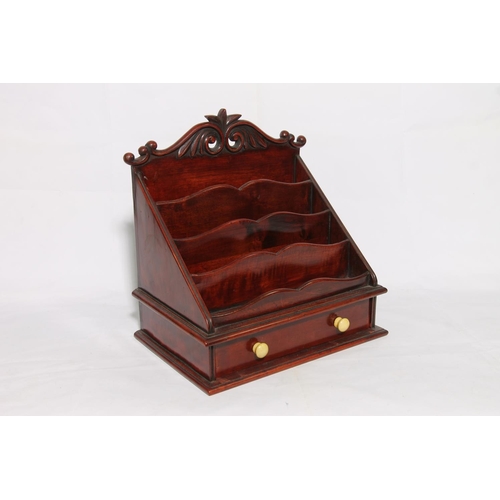 181 - Mahogany stationery rack with base drawer, 33cm high.