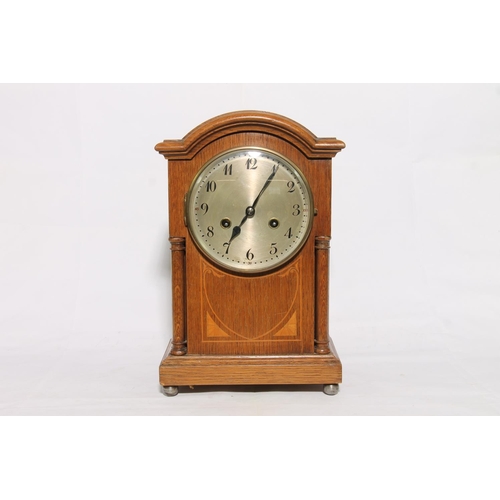 185 - Oak cased arch top mantel clock, 34cm high.