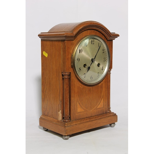 185 - Oak cased arch top mantel clock, 34cm high.