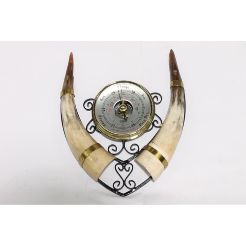 189 - Horn model of a five masted sailing ship, 51cm long, and a horn wall barometer.