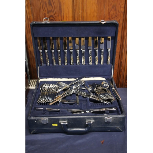 19 - Blue leatherette briefcase containing a suite of Suissine flatware.