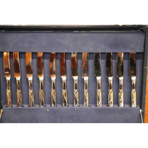 19 - Blue leatherette briefcase containing a suite of Suissine flatware.