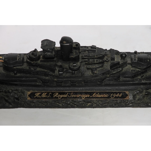 195 - Coal carved model of HMS Royal Sovereign Atlantic 1944 by Collier Row, 36cm long.