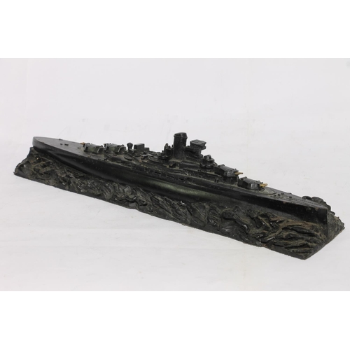 195 - Coal carved model of HMS Royal Sovereign Atlantic 1944 by Collier Row, 36cm long.