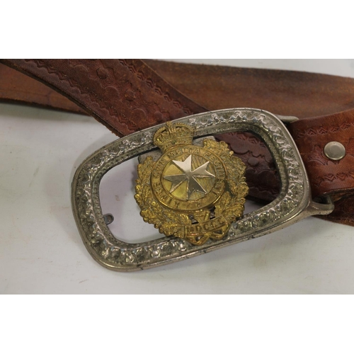 203 - Kings Own Malta Regiment belt buckle on brown leather belt.