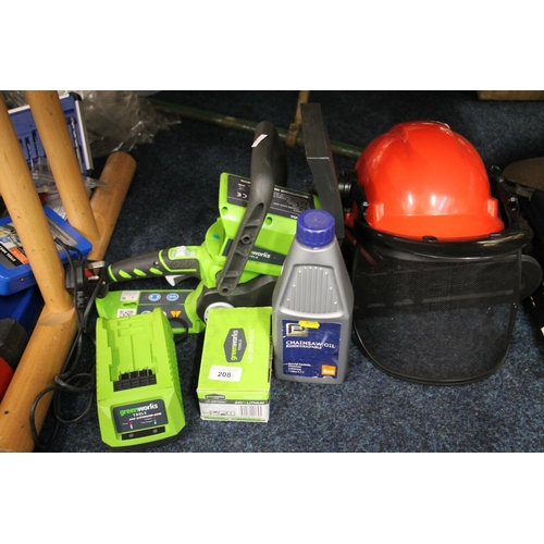 208 - Greenworks electrical chain saw with safety helmet and oil.